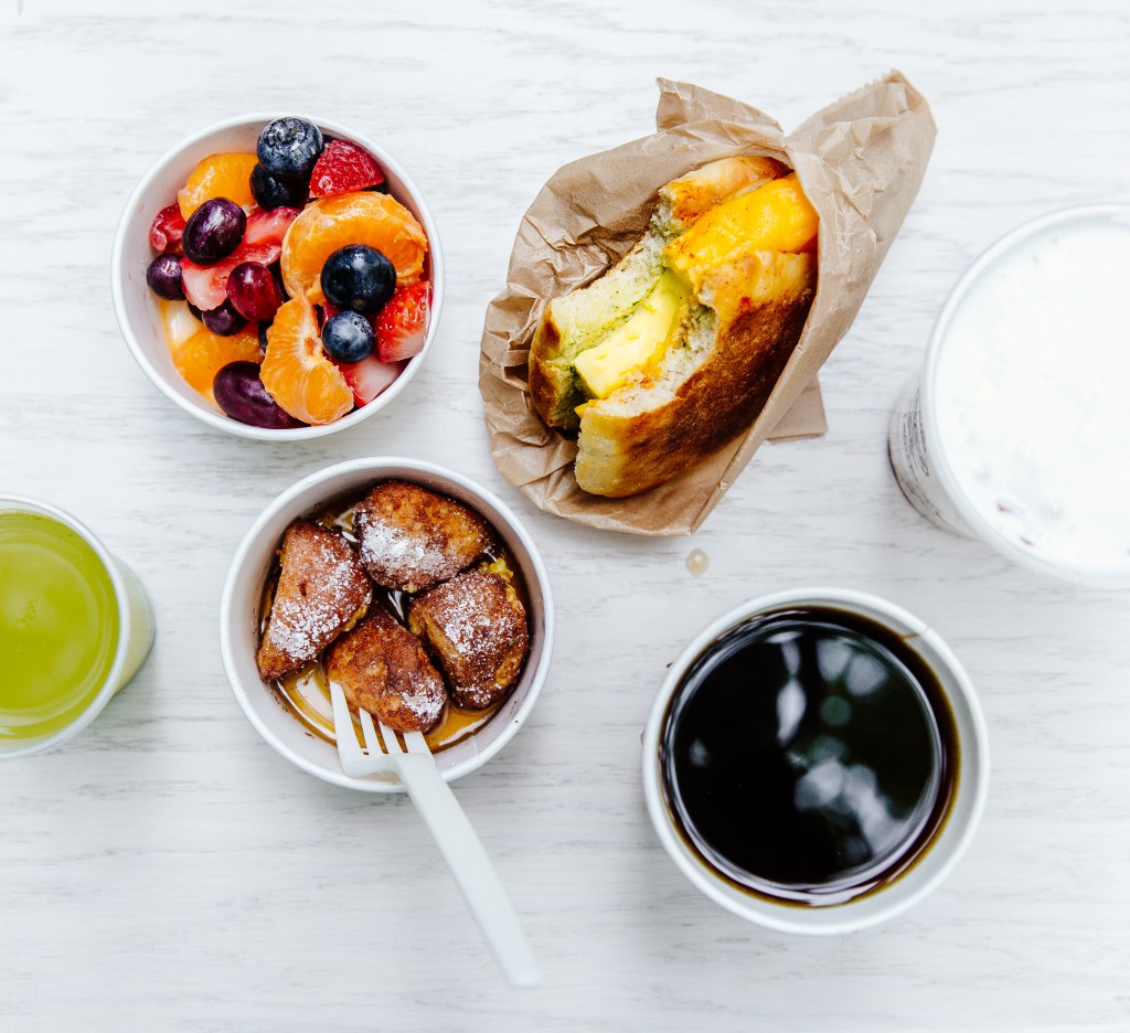 Brekkie Egg in the Hole, French Toast Holes, Yogurt and Granola, Fresh Fruit, Coffee and Green Juice. Photo by Audrey Ma.