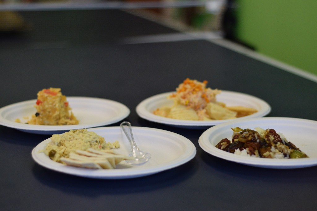 Clockwise from top left: Zheng's Fritos-ramen-casserole, Agakian's jalapeno-ramen-tuna on chips, Thao's Chinese sausage fried rice, Seuga's tuna-ramen on saltines. Photo by Kiwi Illafonte.