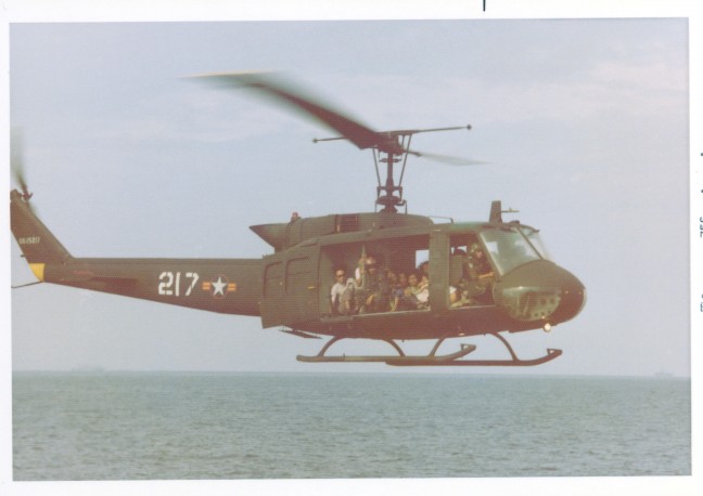 Refugees are flown in a helicopter, c. 1975. Image courtesy of Hugh Doyle.