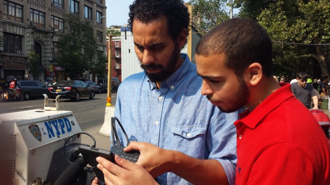 Hany Massoud (Production Mentor) reviewing footage with Ahmed on location in NYC. Photo by Riyaz.