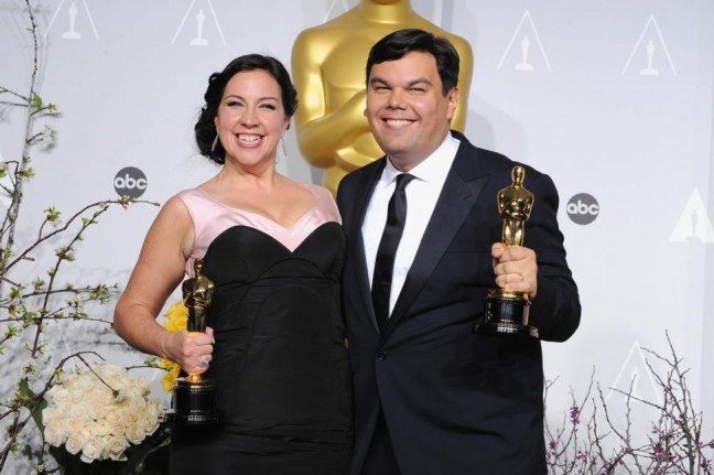 Robert Lopez (R) with wife and writing partner, Kristen Anderson-Lopez after winning the Oscar for "Let it Go" from "Frozen." (Photo credit: Steve Granitz/WireImage)
