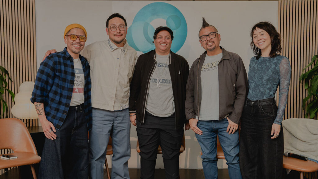 five Asian people on a stage